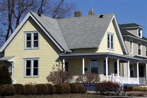 yellow house with gray roof